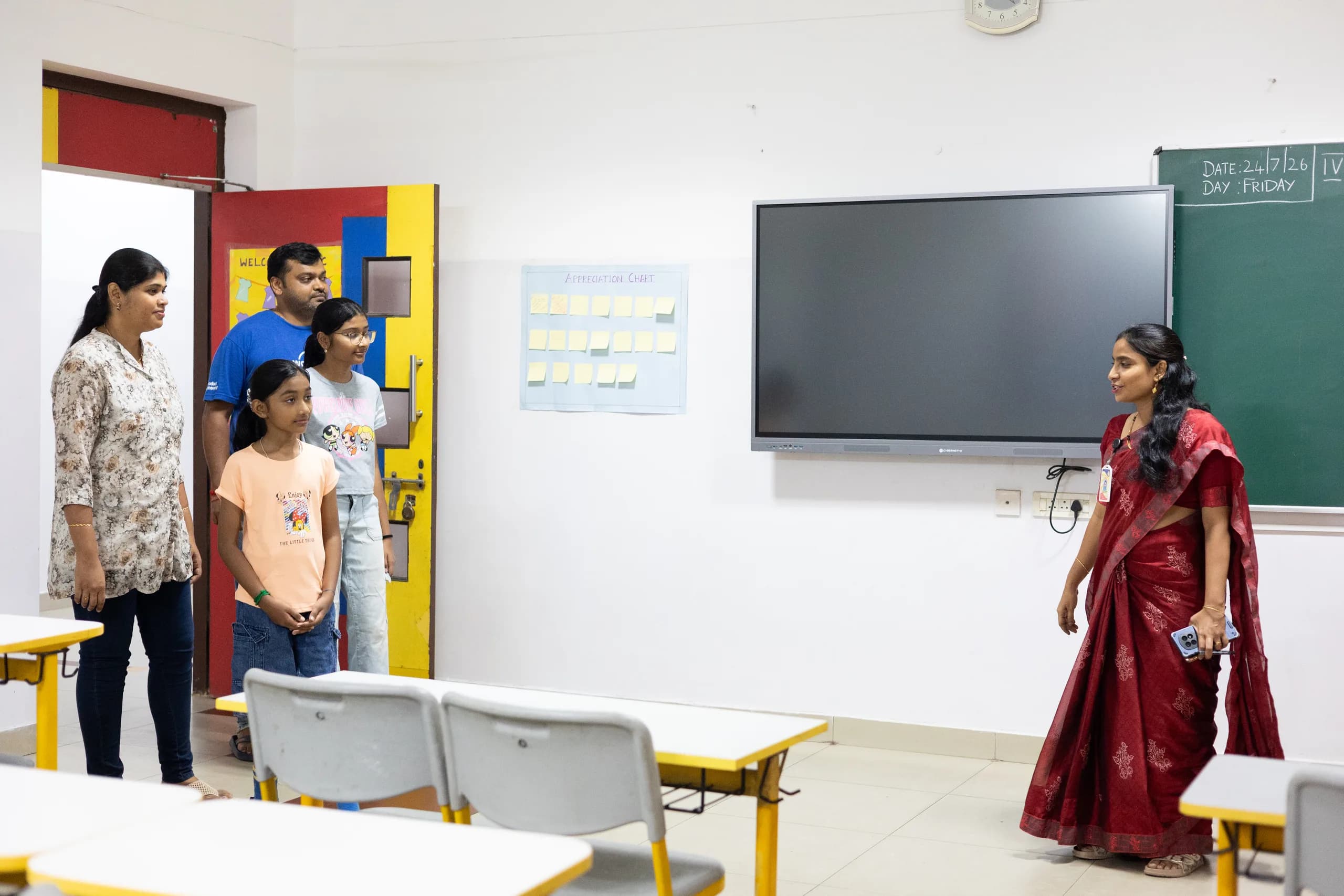 Parents and student consulting with admissions staff at Vaels International School