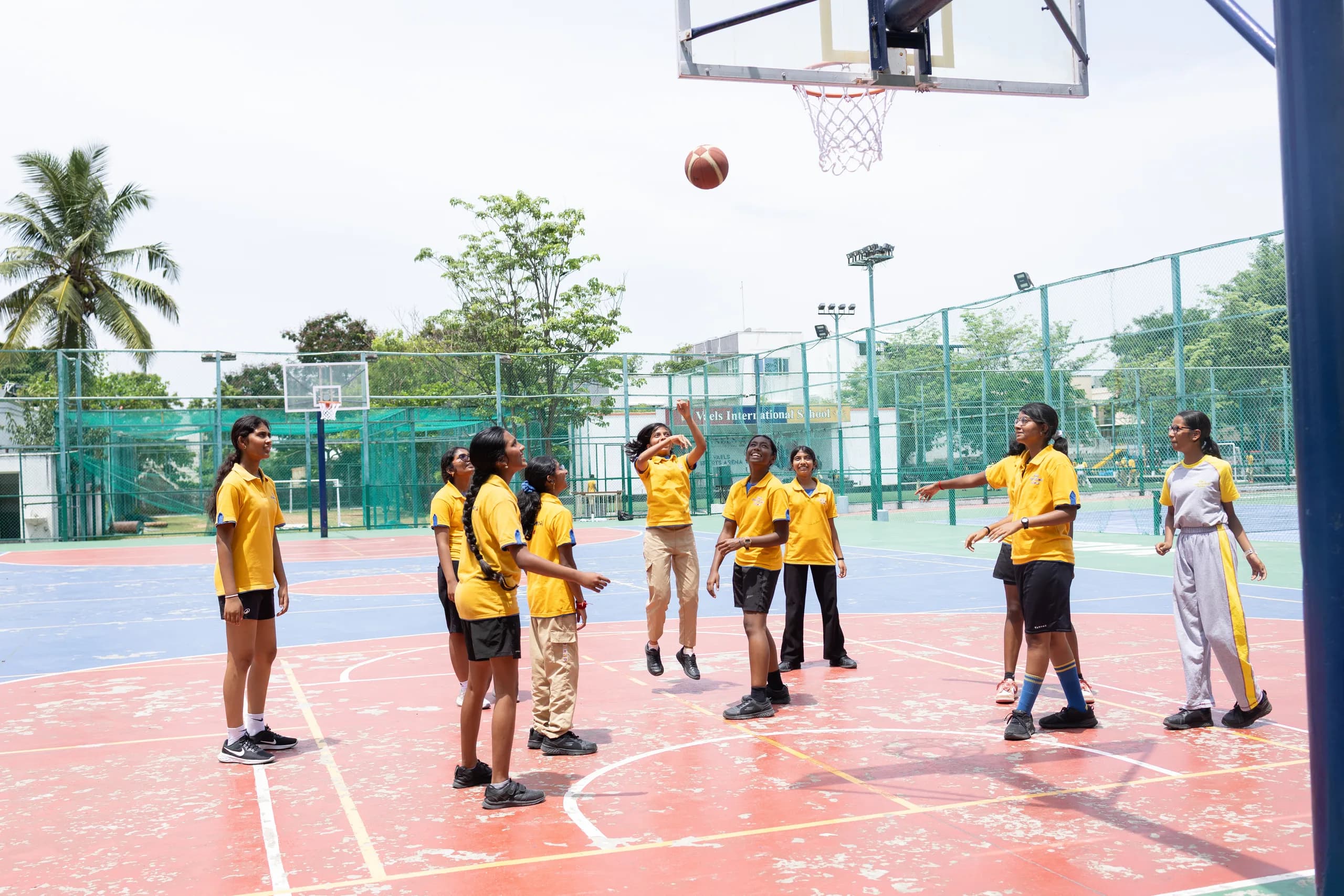 Vaels basketball team in a huddle during a match timeout