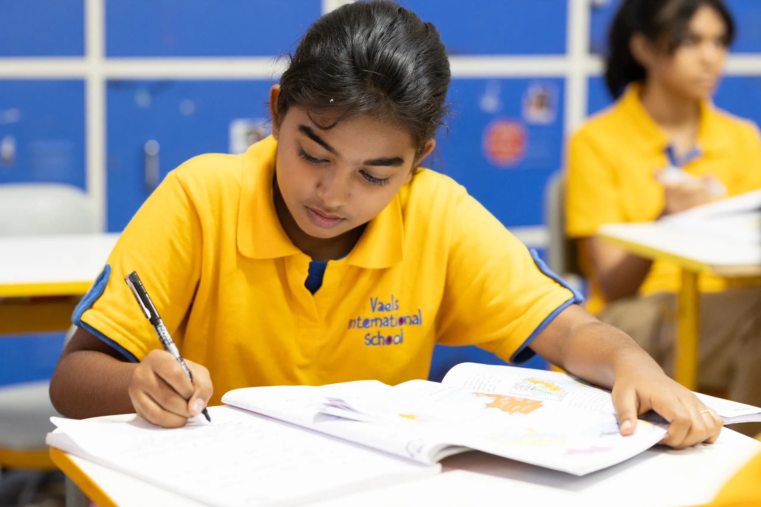 An engaged Class 7 student during a lesson at Vaels International School