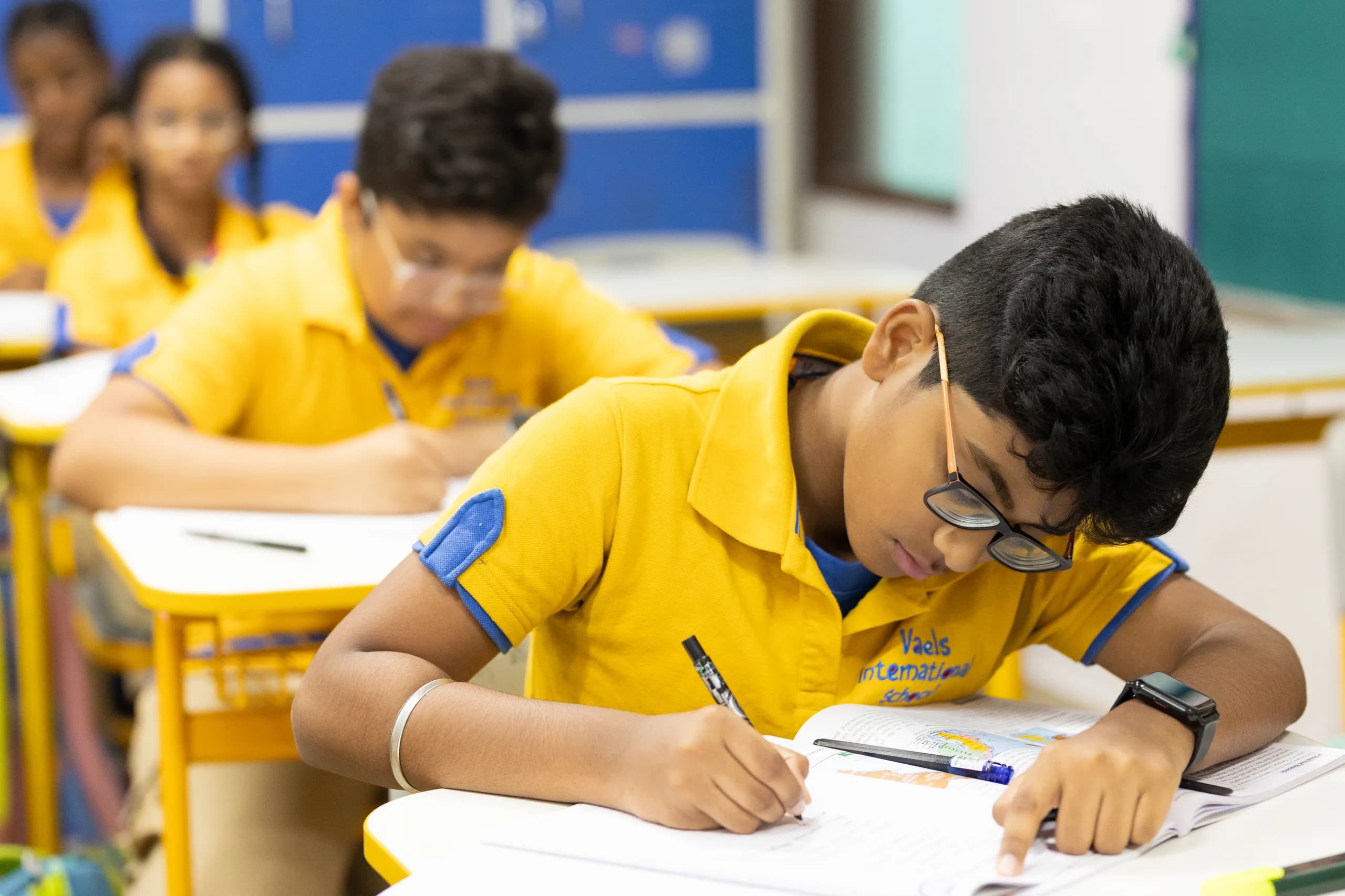 Class 7 students in quiet concentration during their lesson