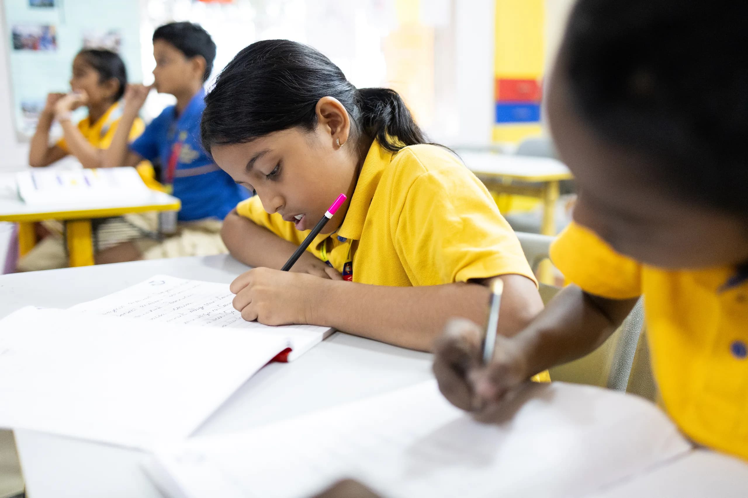 A Grade 4 student mid-activity in the classroom