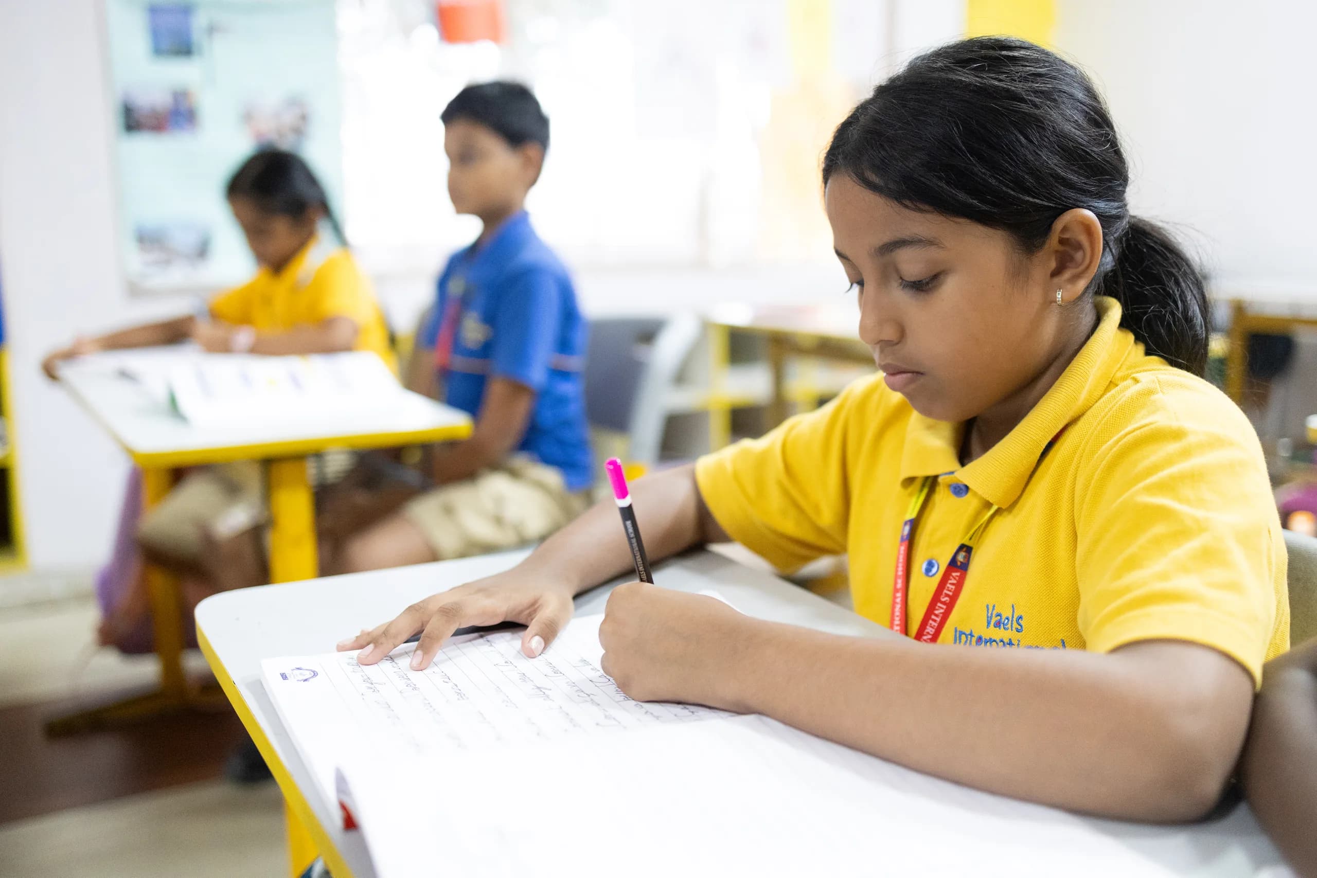 Grade 4 student engaged creatively in a lesson