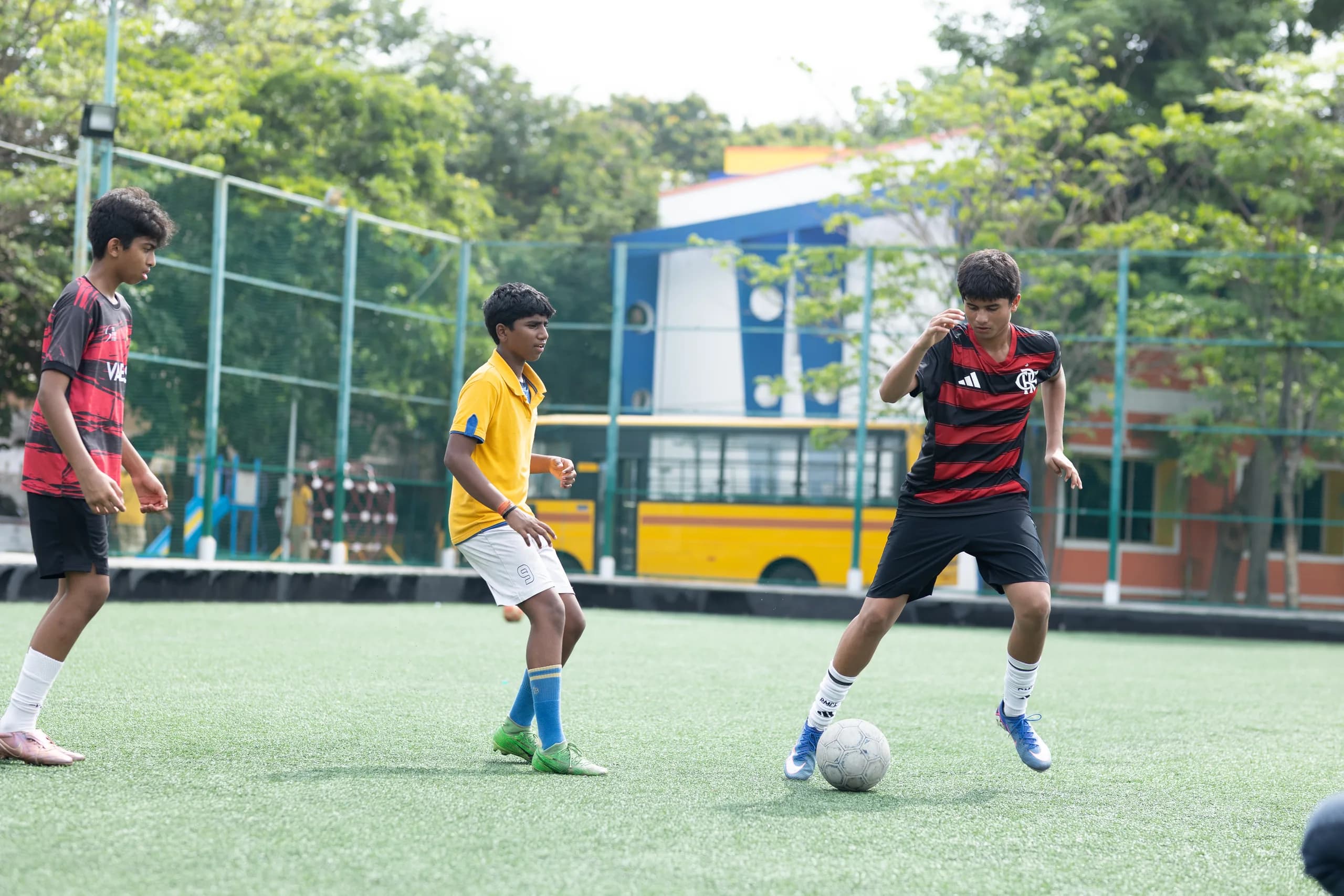 High-intensity boys football match action on the Vaels field
