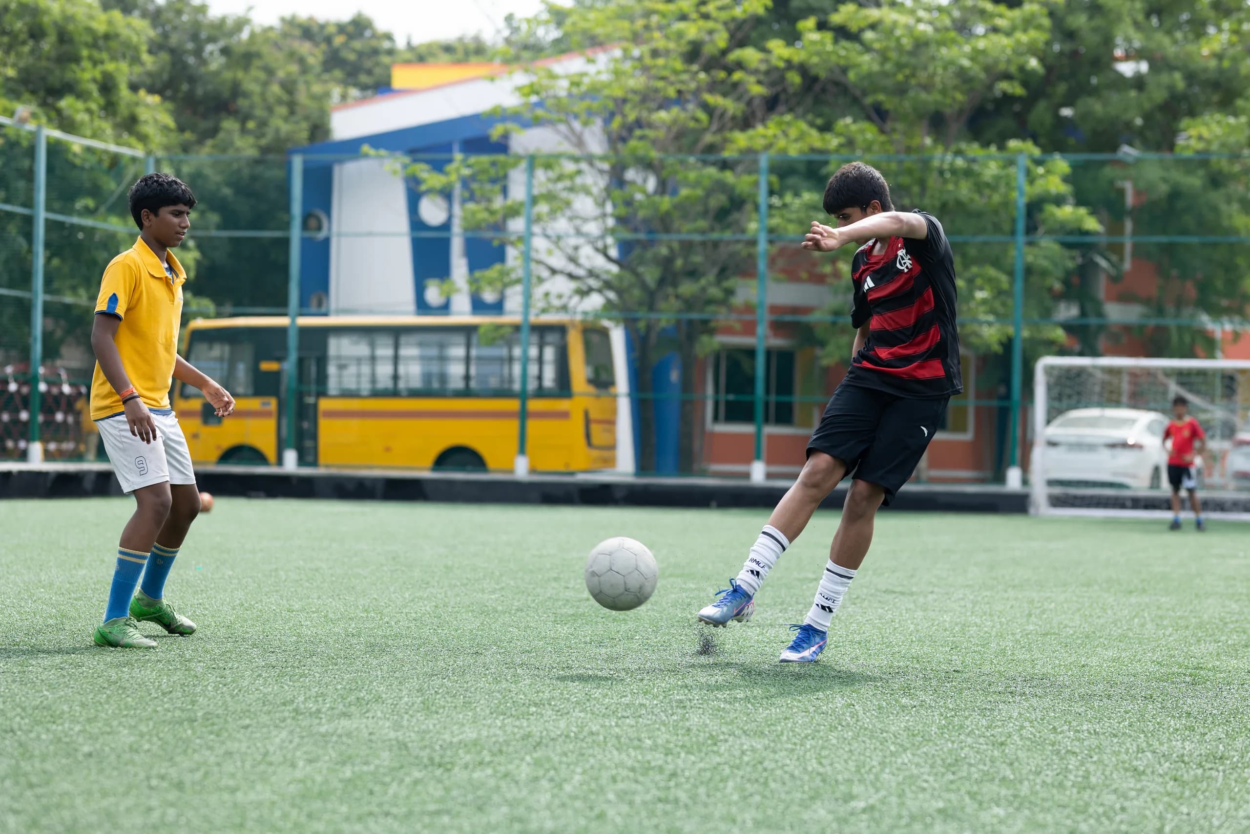 Boys football players showing energy and determination mid-game