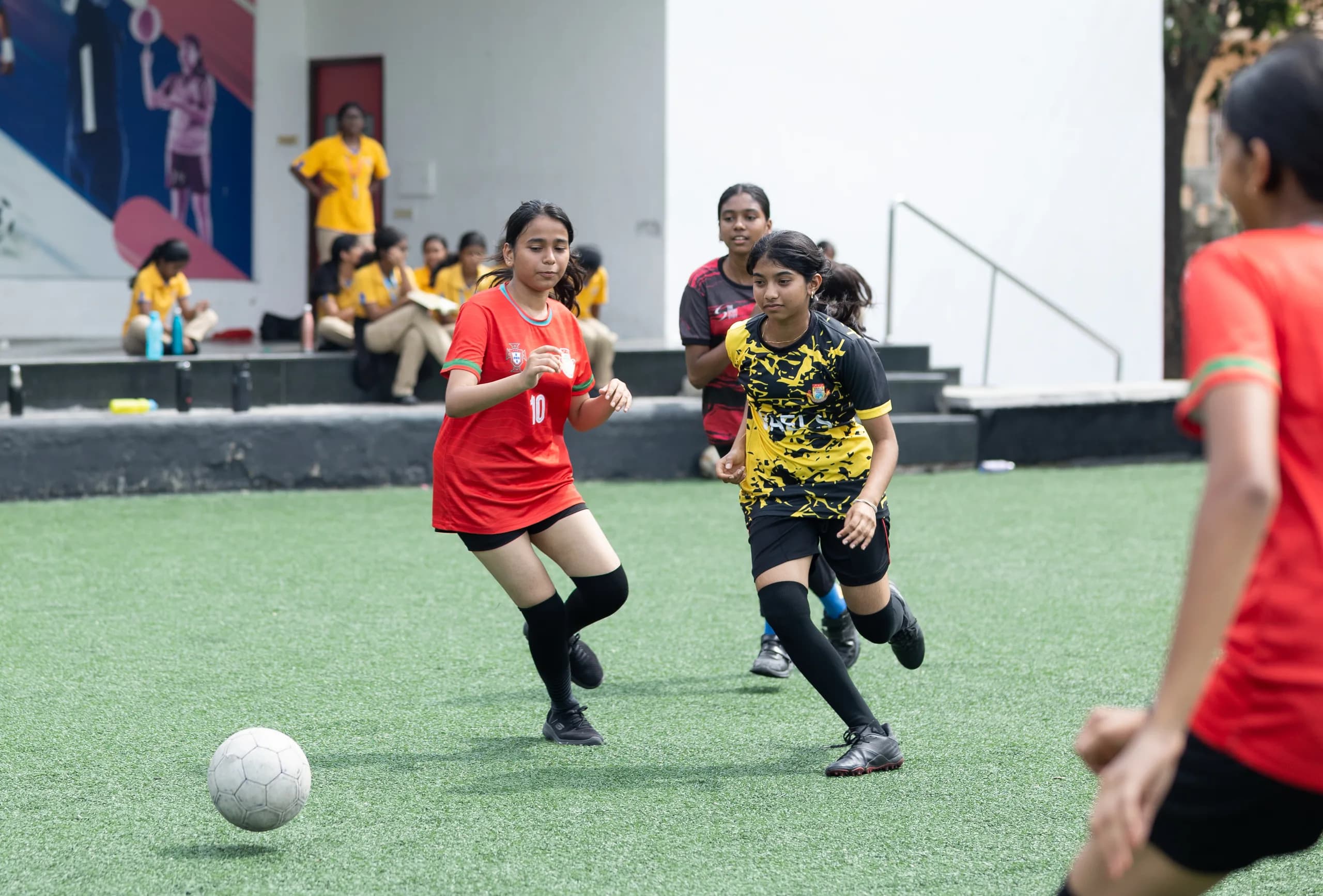 A girls football player executing a dribble during a match