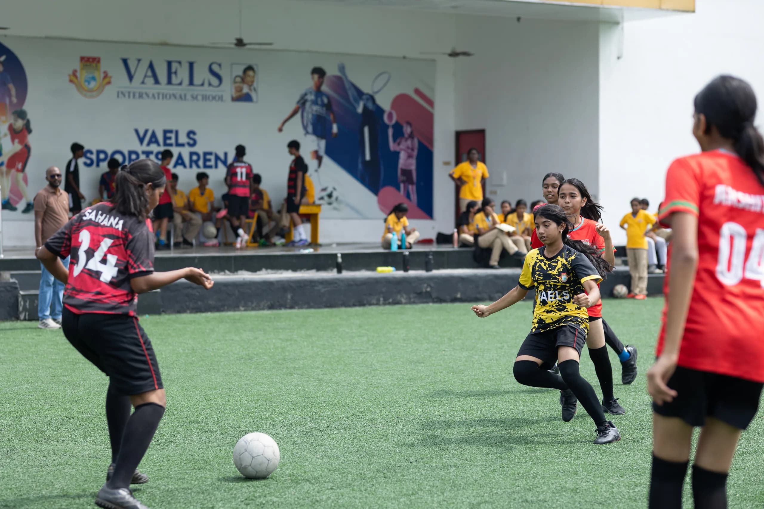 Girls showing competitive spirit during a football match at Vaels