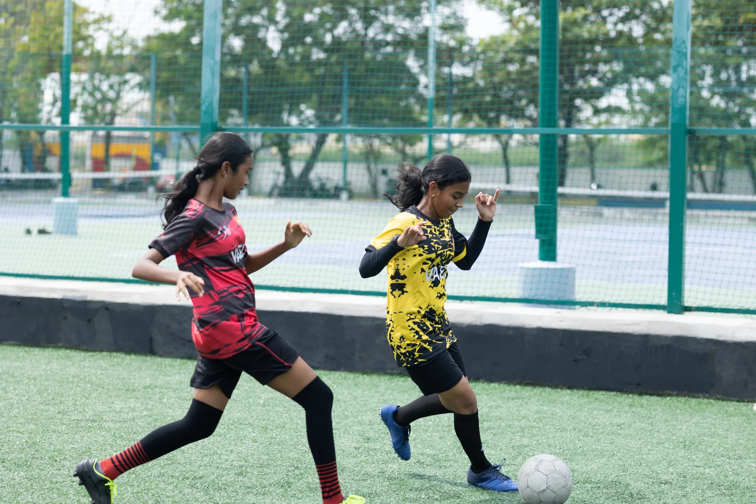 Girls football team demonstrating excellent teamwork on the field