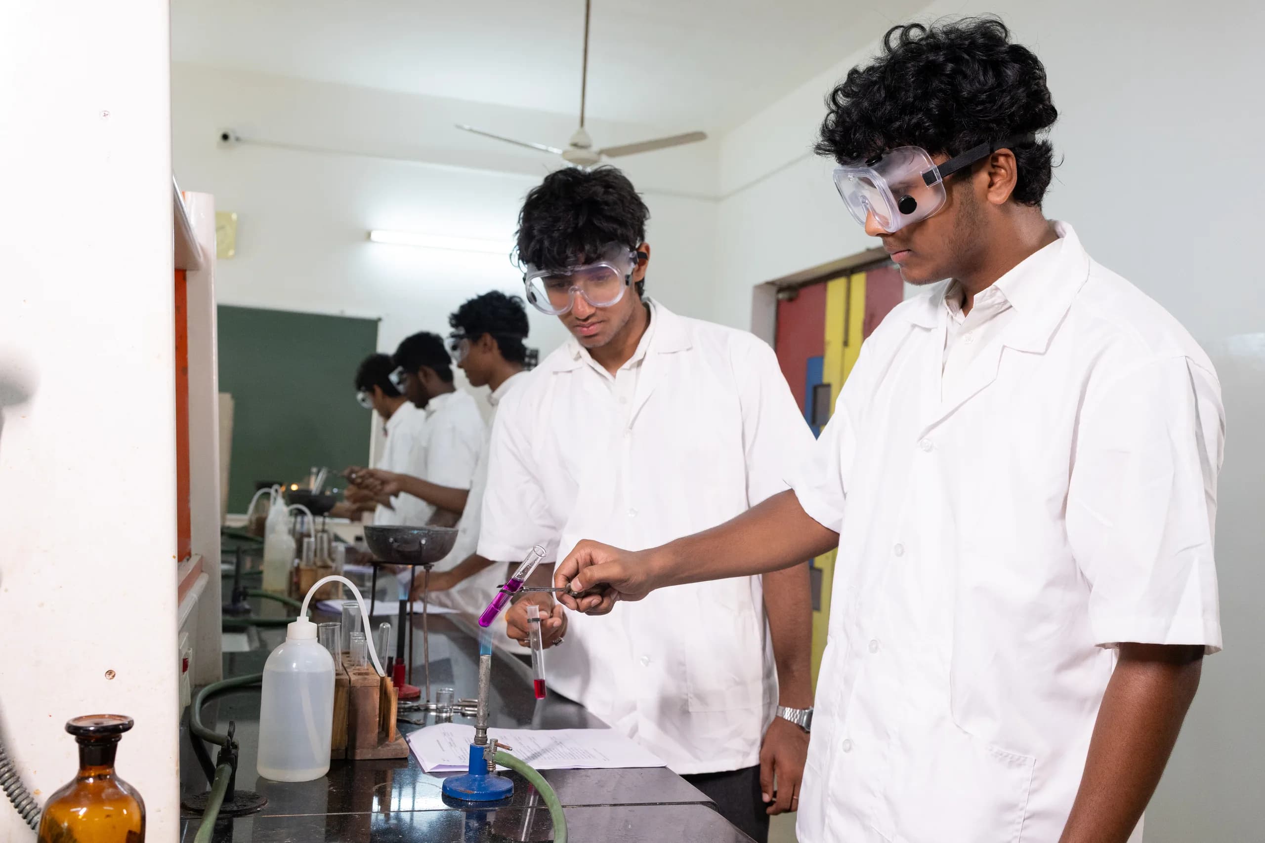 Students conducting a chemistry experiment at Vaels High School