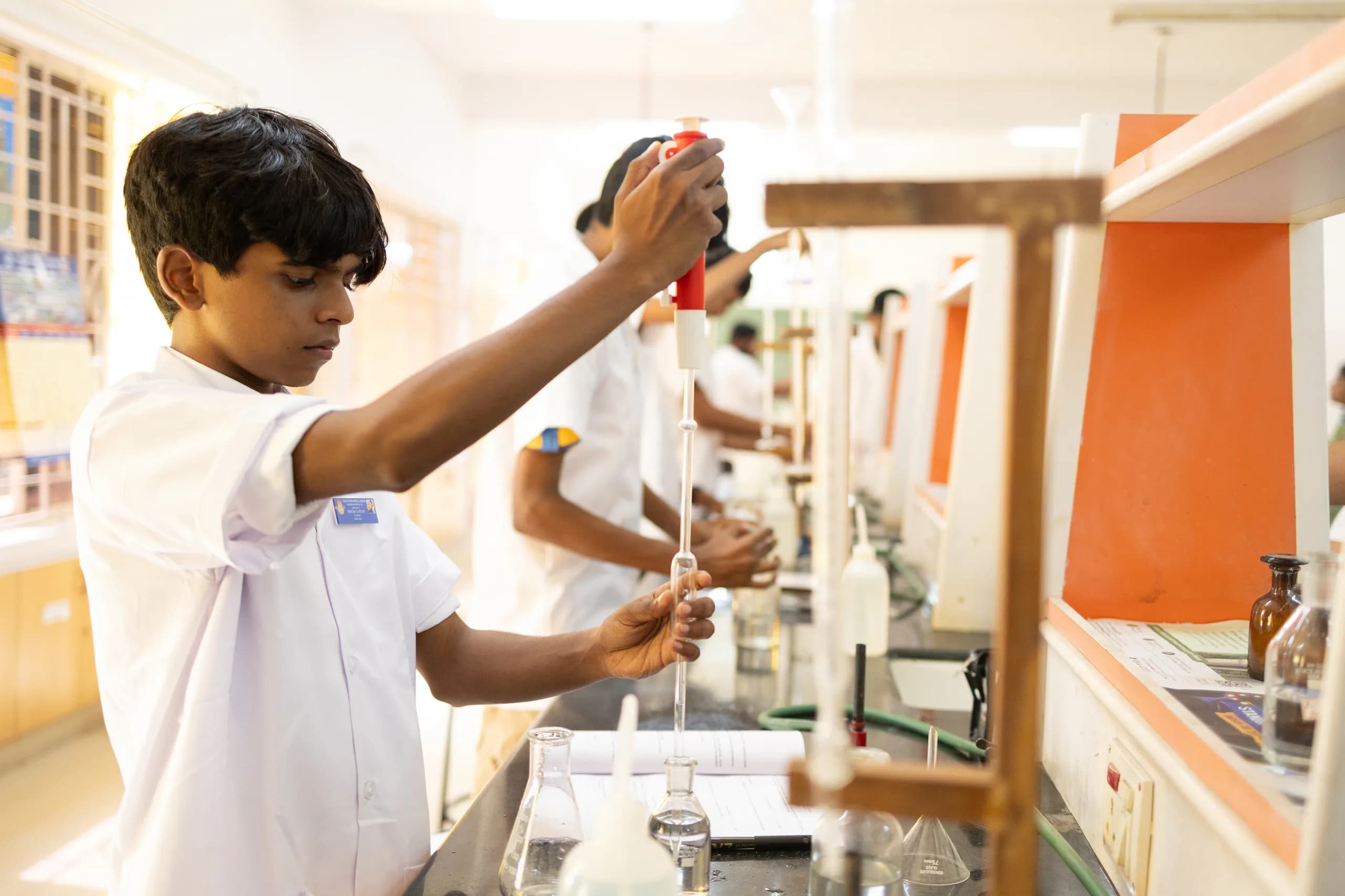 Group of students conducting a group chemistry experiment