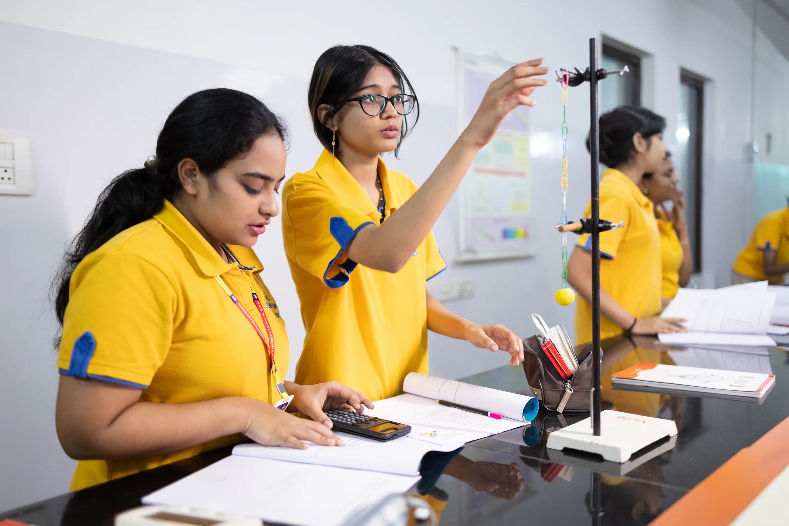 Students taking precise measurements in the physics lab
