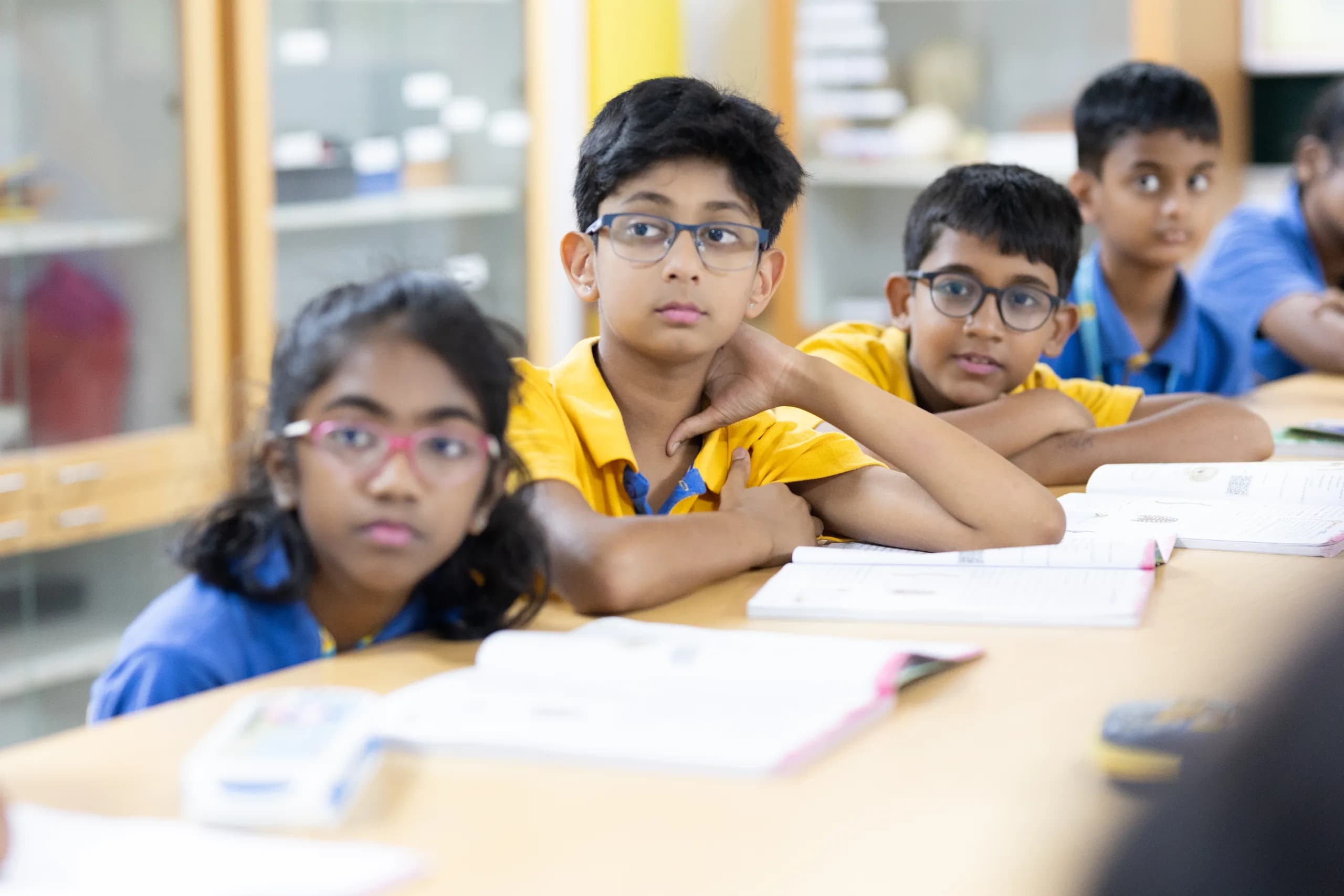 Students engaged in digital learning at the Quess lab
