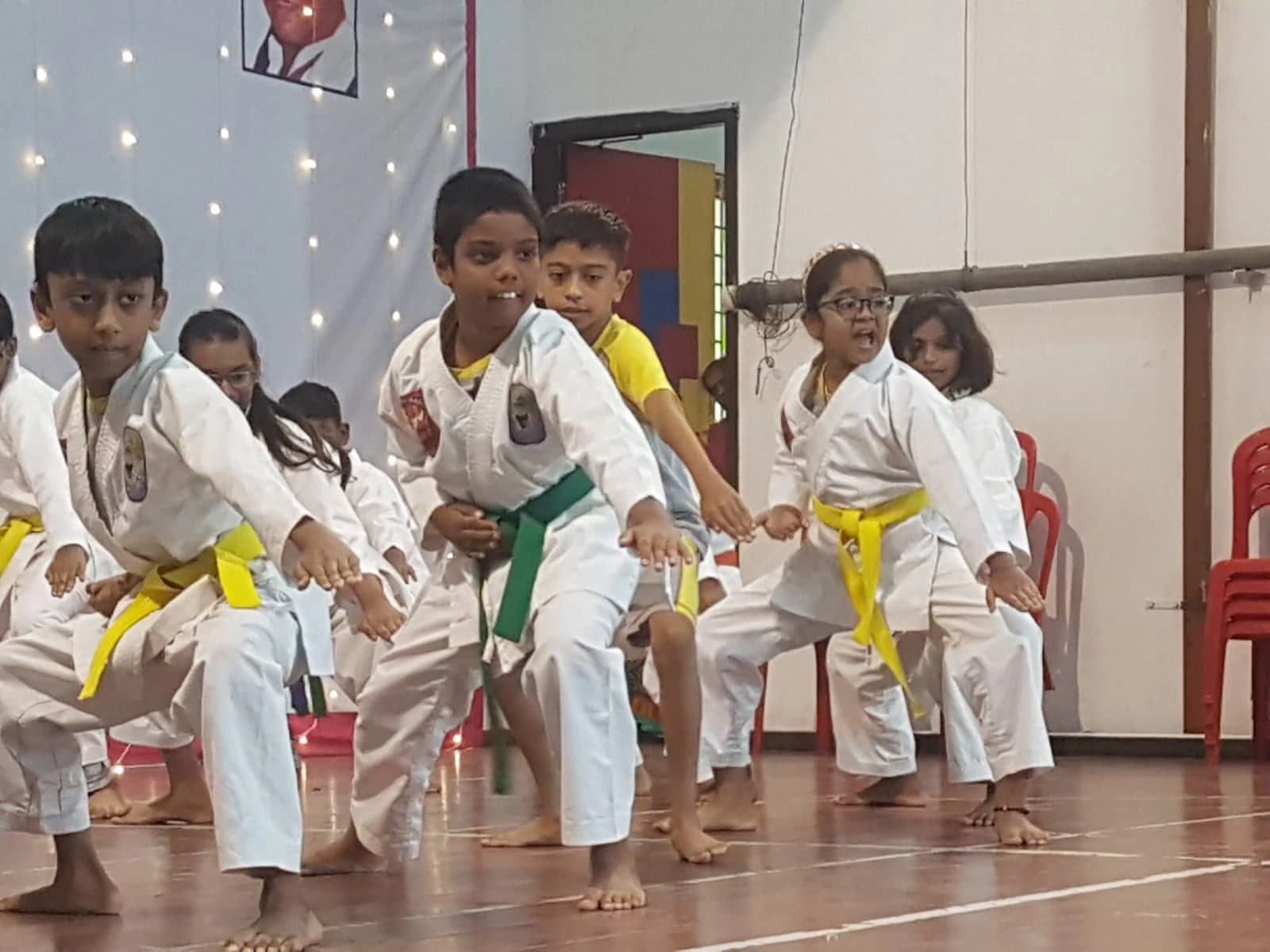 Students in karate uniforms during training class